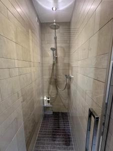 a bathroom with a shower in a tiled shower at Civico6 in Tirano