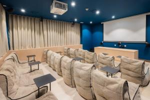 a conference room with chairs and a projector screen at Stephouse Pozuelo Europa in Madrid +68 photos