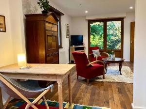a living room with a table and chairs at Gite du Ried in Bischwiller