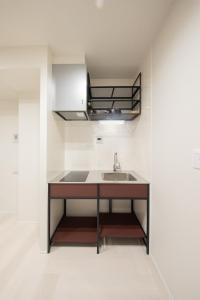 a kitchen with a sink and a counter at Hotel Kototoi East in Tokyo +43 photos