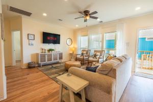 a living room with a couch and a table at Ocean View l Pet Friendly in Gilchrist