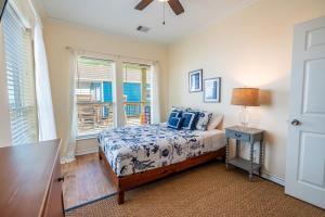 a bedroom with a bed and a window at Ocean View l Pet Friendly in Gilchrist