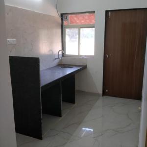 a kitchen with a sink and a window at Zen Villa in Murūd