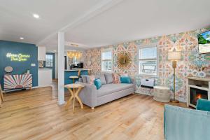 a living room with a couch and a fireplace at Salisbury Sol Pet Friendly Private Balconies in Salisbury +49 photos