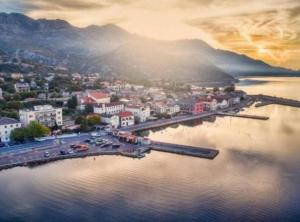 an aerial view of a town on a body of water at Apartment Sea View in Karlobag +7 photos