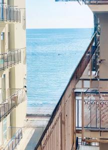 a view of the ocean from the balcony of a building at Art home Amalfi coast in Salerno
