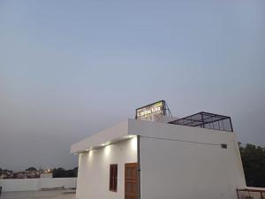 a white building with a sign on top of it at The Ashoka Palace Near Ram Mandir in Ayodhya