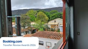 a view out of a window of a building at Casa dos Coelhos, 750m do centro, até 12 pessoas in Tiradentes