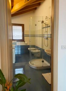 a bathroom with two sinks and a glass shower at Casa Sole in Vercana +80 photos