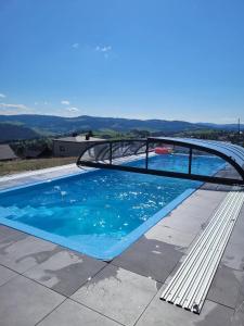 a swimming pool on top of a house at Pensjonat Halny Jaworzynka in Jaworzynka