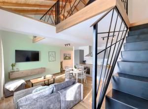 a living room with a couch and a staircase at Apartments Zanet & Niccolo in Fažana