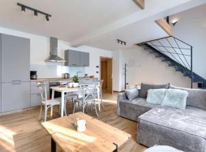 a living room with a couch and a table at Apartments Zanet & Niccolo in Fažana +20 photos