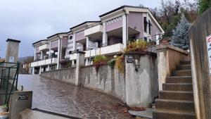a flooded street with a row of houses at "Vento di Levante Suite" benvenuti in collina in Casarza Ligure