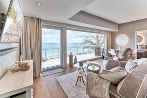 a living room with a view of the ocean at Sea View Suite in Scharbeutz