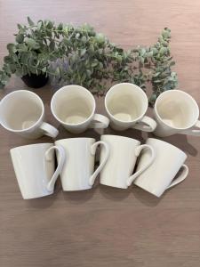 four coffee cups and saucers sitting on a table at 蔵 The KURA in Urayasu