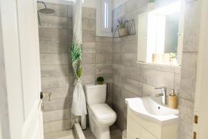 a bathroom with a toilet and a sink at The litlle mermaid in Amaliapoli +44 photos