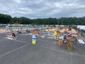 a group of children playing in a playground at Camping San Lanaco in Lanaken