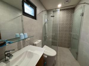 a bathroom with a toilet and a sink and a shower at Shin Mei B&B in Puli +11 photos