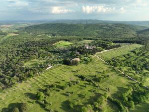 an aerial view of a farm in the hills at Tuscan Farmhouses at Castello del Calcione Estate in Lucignano