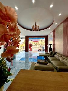a living room with a couch and a table at Motel Mai Thu in Thăng Bình