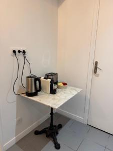 a counter with a coffee maker on a table at Le Petit Sancerrois in Sancerre