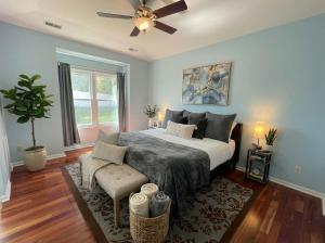a bedroom with a bed and a ceiling fan at Charming Ranch Retreat in Bear Delaware in Bear