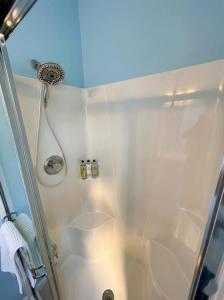 a shower in a bathroom with a glass door at Charming Ranch Retreat in Bear Delaware in Bear