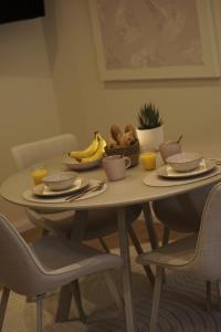 a table with a bowl of food and fruit on it at Cozy apartment in Irrel in Irrel