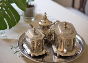 two tea sets on a silver tray on a table at La Casa de Vegueta in Las Palmas de Gran Canaria +29 photos