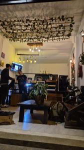 a group of people in a room with a table at Hotel Casa Bambu in Calima