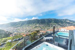 a swimming pool with a view of a mountain at Villa Sofia by Atlantic Holiday in Machico