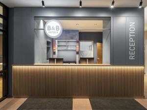 a view of the front of a building with a bbc house sign at B&B Hotel Leipzig-City in Leipzig