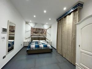 a bedroom with a bed in a room at Li Cumpari salentini in Lecce