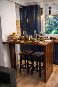 a kitchen with a large wooden table with chairs at Studio Noa Escape in Saturn +10 photos