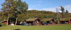 a group of buildings with cars parked in front of them at noordwind camping galsklint in Middelfart