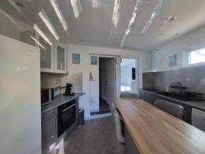 a kitchen with a wooden counter top in a room at Soleillas in Vence