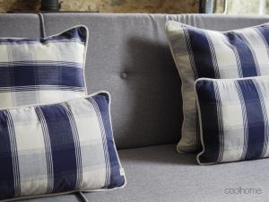 two pillows are sitting on a couch at 12 Casa d'Avó in Albergaria-a-Velha
