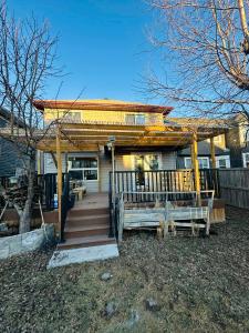 a house with a gazebo and a staircase leading to it at Jeli haus in Calgary