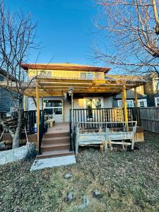 a house with a gazebo and a staircase leading to it at Jeli haus in Calgary
