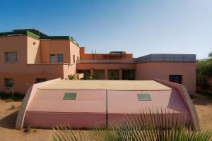 a building with a tent in front of it at Chateau Nougat, Marrakech in Marrakesh
