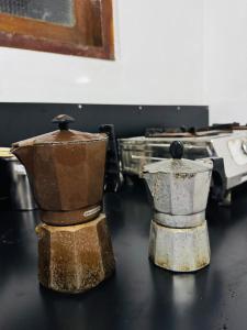two containers sitting on top of a table at Nihal Villa in Weligama