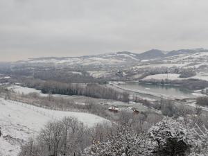 a view of a river in the snow at B&B 3B Cavriana in San Valentino