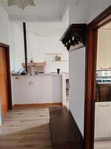 a kitchen with a counter top and a refrigerator at B&B 3B Cavriana in San Valentino +8 photos