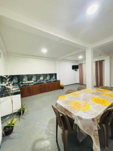 a large room with a table and chairs in it at Lumora - Midigama in Midigama East