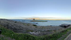 an island in the middle of a body of water at Il Mascone in Stintino