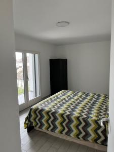 a bedroom with a bed and a large window at Via privata in Lugano