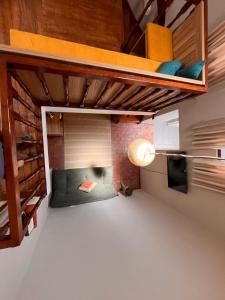 a bedroom with a bunk bed in a room at Casa Terra Cusco in Cusco