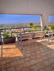 a group of benches sitting on top of a building at Tusmo homes in Ongata Rongai 