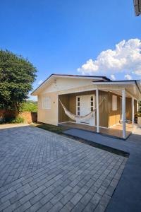 a house with a large driveway in front of it at ROTA DA SERRA casa completa com ar-cond in Orleans