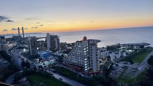 an aerial view of a city with the ocean at Amber – 10th Floor Sea View Studio, Kaslik in Jounieh